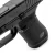 Aluminiowy przyciski zrzutu magazynka Eemann Tech zamontowany na pistolecie Glock Gen 6. Widok od góry krzywizny elementu.