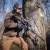 Tłumik Gomander TACTINOX QD-LOCK L 5.56 mm na karabinku AR15 z zamontowaną lunetą biegową.